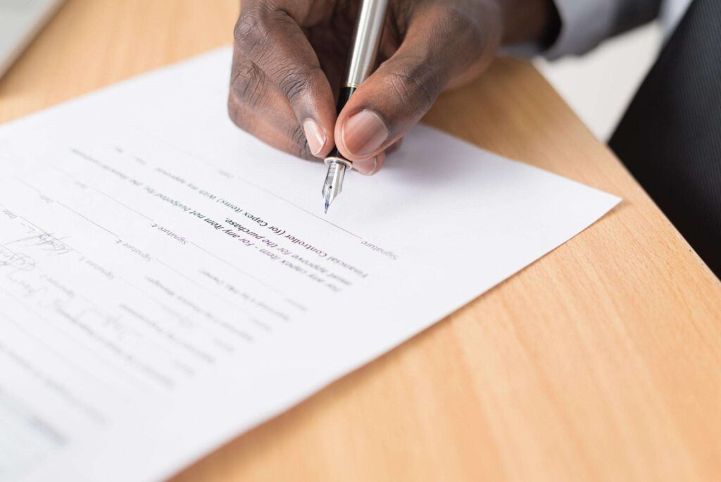 Person signing the Singapore Copyright Act to promote innovation