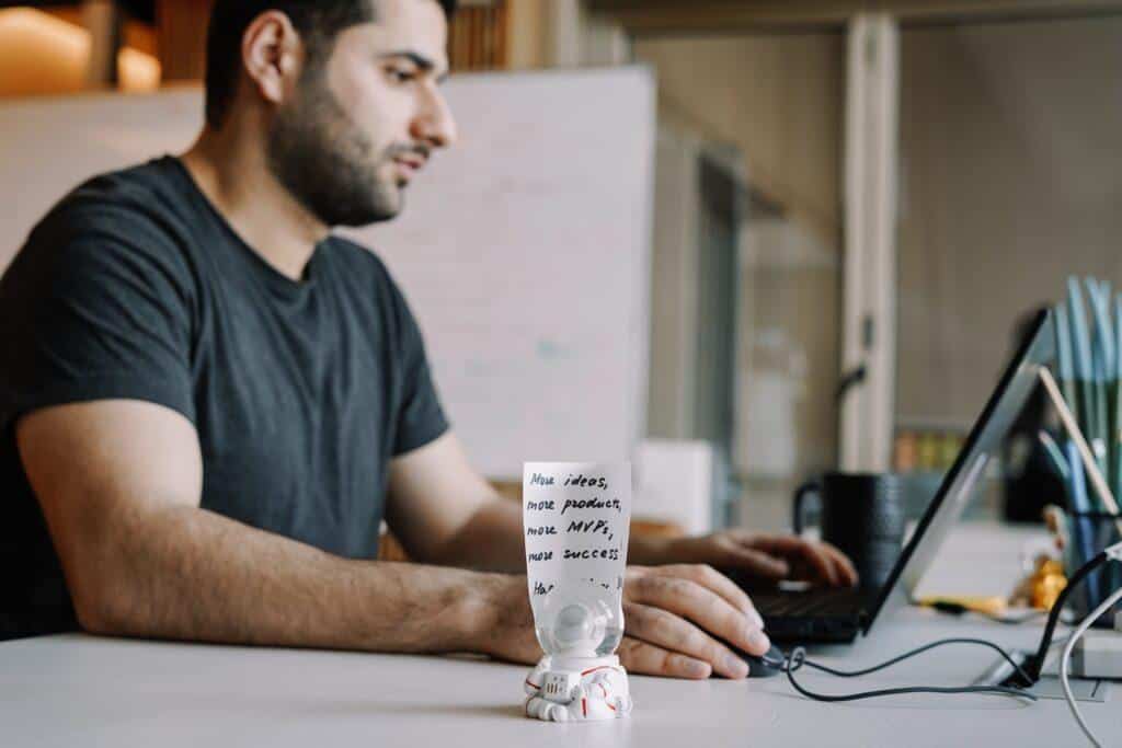 Company employee working on his laptop to fulfill the company's corporate social responsibility