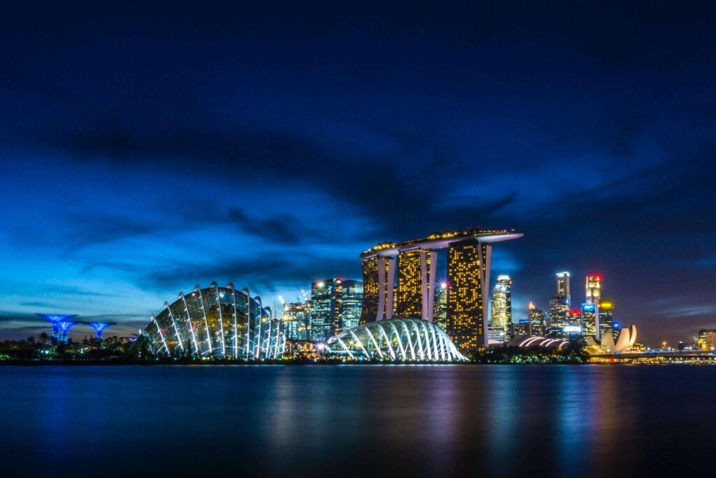 Singapore landscape of buildings at night representing the advantages of Singapore for business