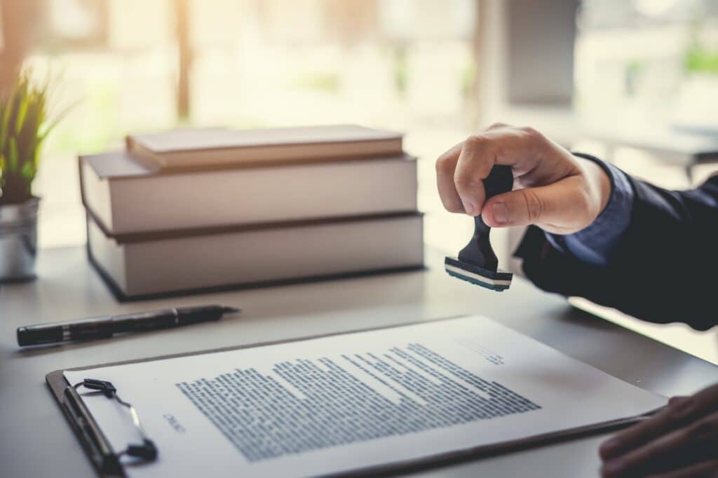 Singapore Notary Public stamping and notarizing a document before it can be apostilled or legalized