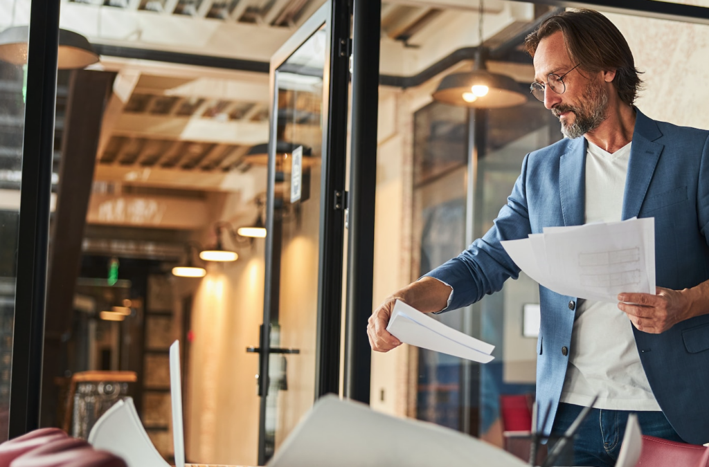 Registered filing agent in Singapore reviewing business documents to make sure the company complies with ACRA legal regulations