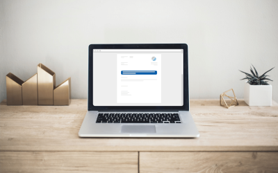 Laptop on a desk with a digital Certificate of Residence in Singapore